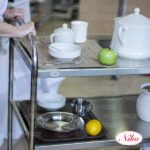 Trolley with two shelves, round tube frame, stainless steel
